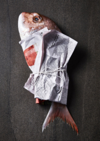 fish wrapped in newspaper